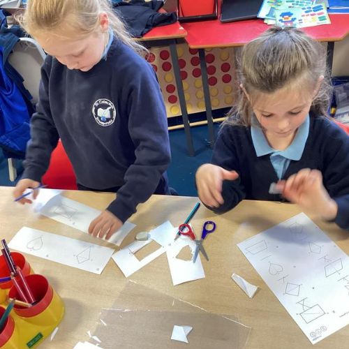 Maths Topic - Investigating lines of symmetry in 2D shapes.