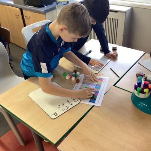 This week the boys and girls in P5B focused on multiplying by 10 and 100 using place value charts to represent this.