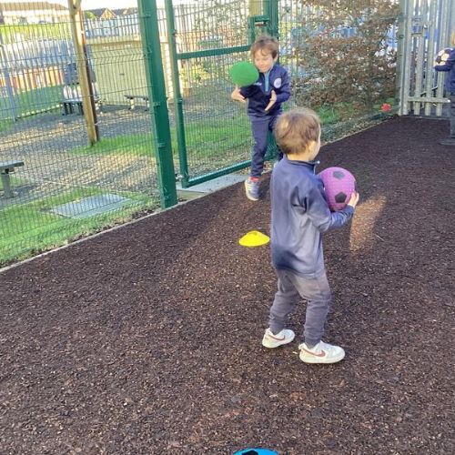 PE: The children have been practising their skills of moving in different ways with a ball