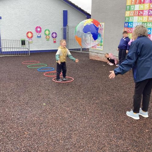 We have been working on our gross motor skills by jumping through the hoops and catching our class World ball.