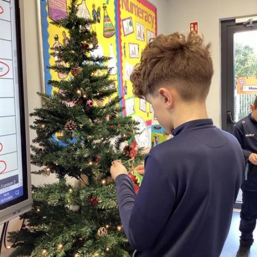 Getting our classroom ready for Christmas by making Christmas decorations, Christmas chains and spirals for our classroom roof and then snow globe art for all around our board.