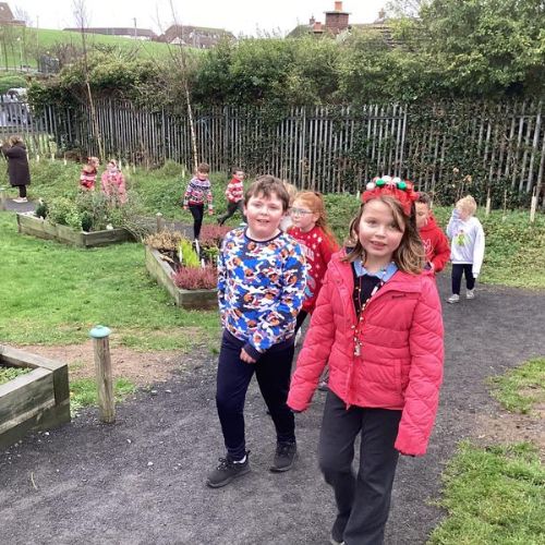 LSC3 enjoying our Christmas Santa run around the daily mile area.