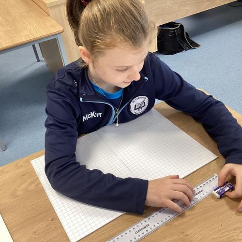 Using a ruler to measure items in the classroom to the nearest cm.
