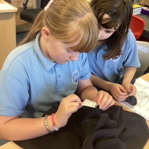 WALT identify the countries our clothes are made in.