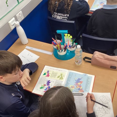 Using an atlas to locate the 32 counties of Ireland